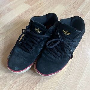 Adidas Black and Gold Sneakers with Classic Style